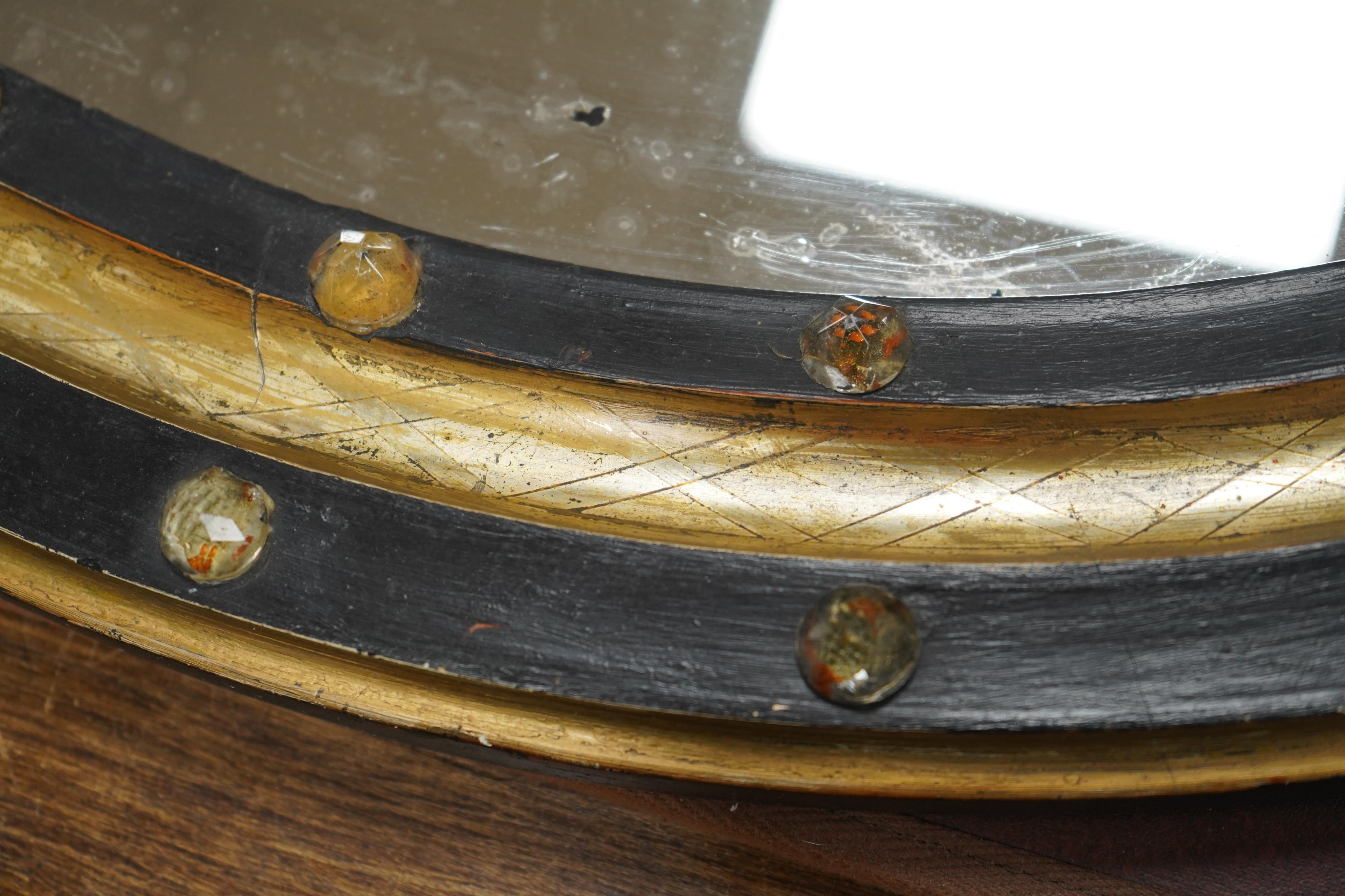 A 19th century oval Irish wall mirror, width 54cm, height 62cm. Condition - fair